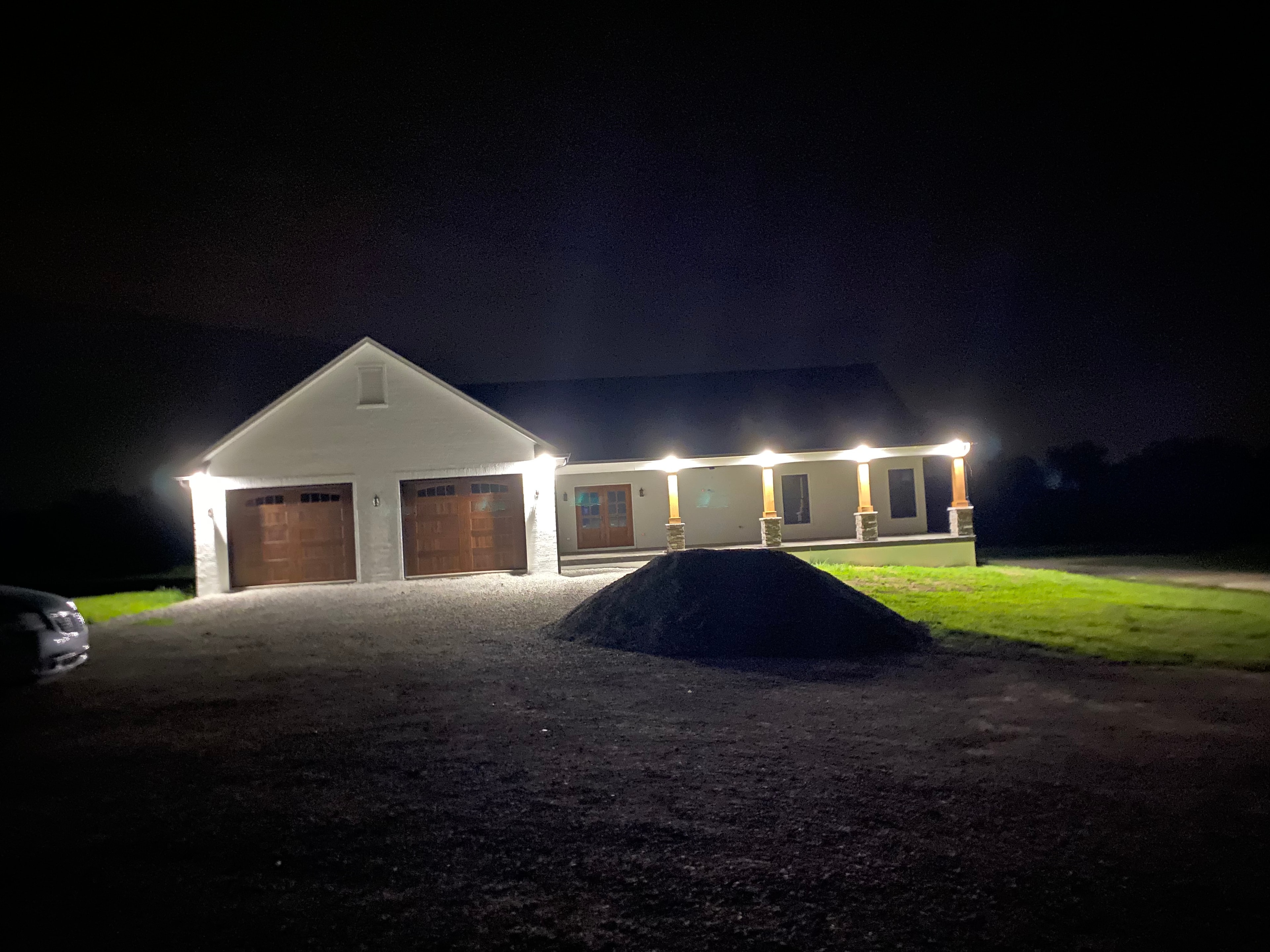 Exterior home lighting installation at night