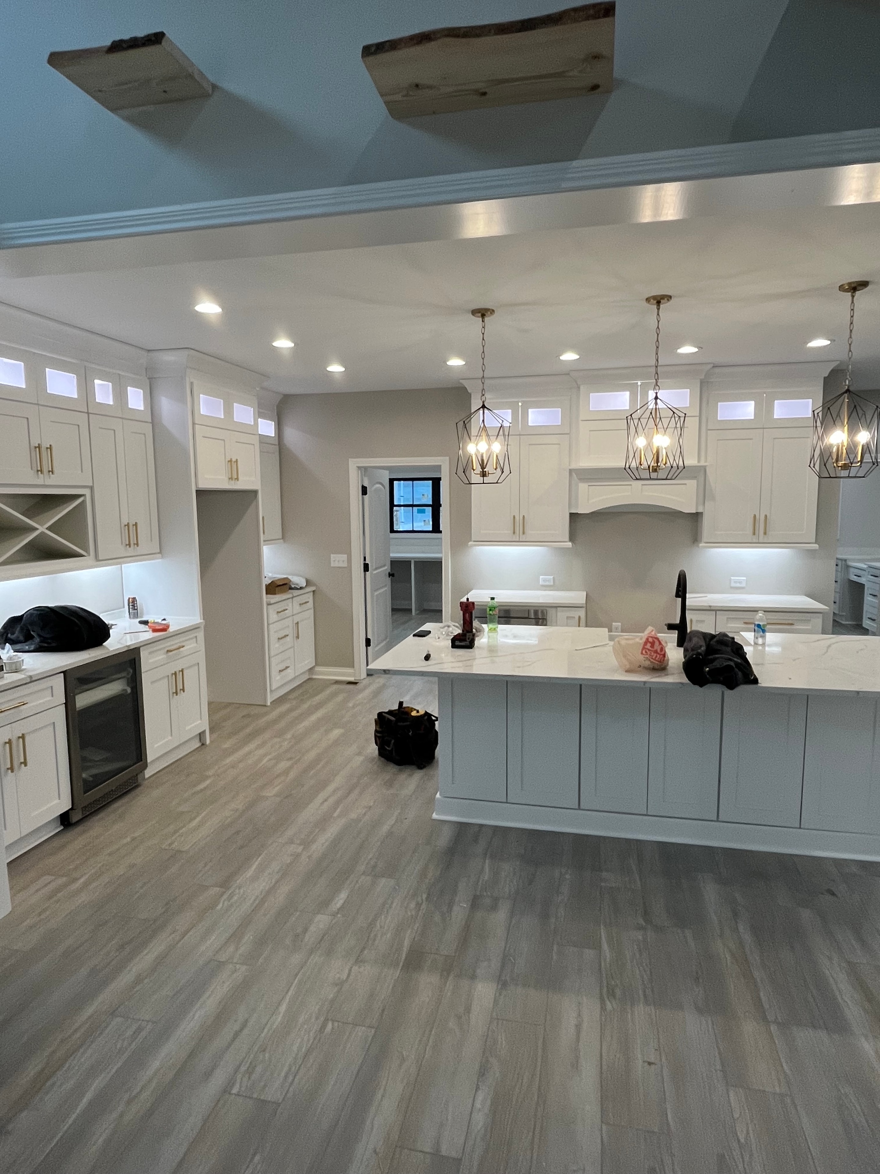 Kitchen cage pendant and recessed lighting installation