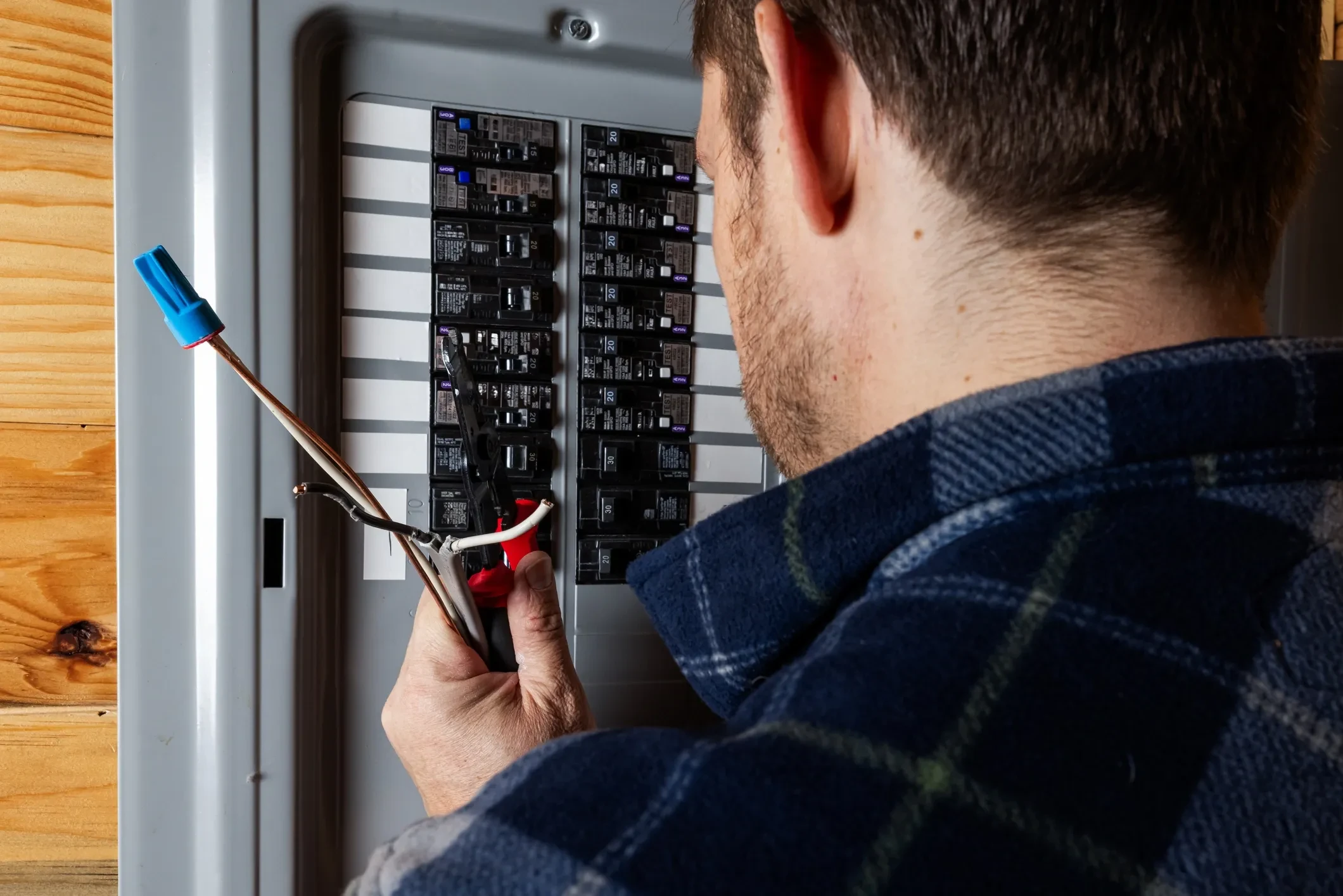 Electrician working on residential panel