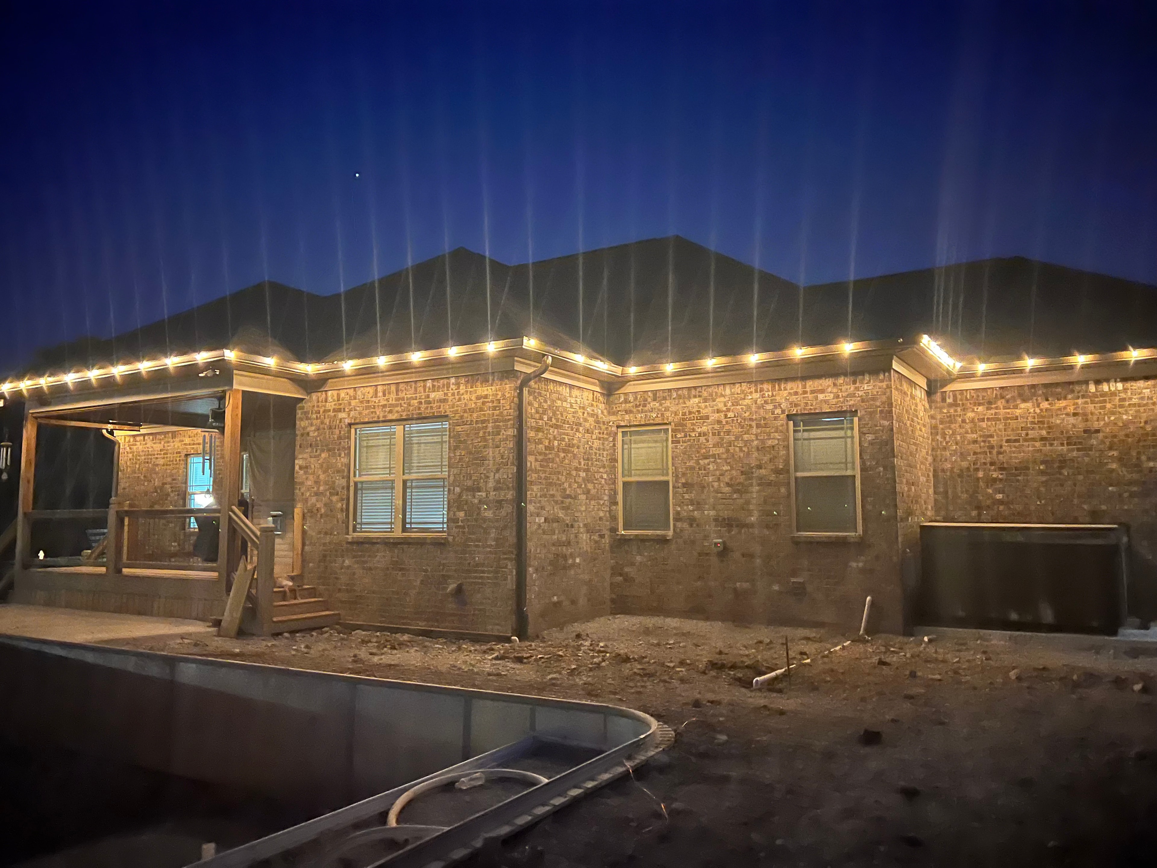 Roofline LED lighting on brick home